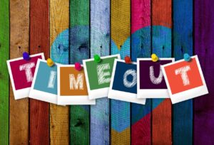 Painted wood with timeout written on sheets of coulorful papers