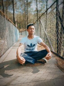 a sportife young man medidating and practising yoga