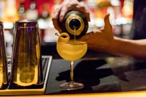 a bartender mixing a cocktail