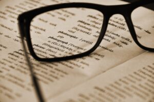 black glasses on an open dictionary on the world book day