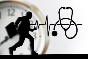 mental resilience - a man in stress, an ecg-heartline and stethoskop with a clock behind ticking
