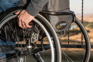 man sitting in his wheel-chair, resilient to his handicaped reality